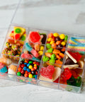 a plastic container filled with lots of candy