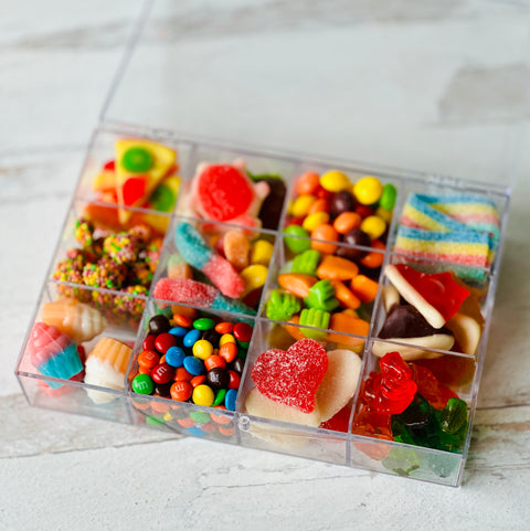 a plastic container filled with lots of candy