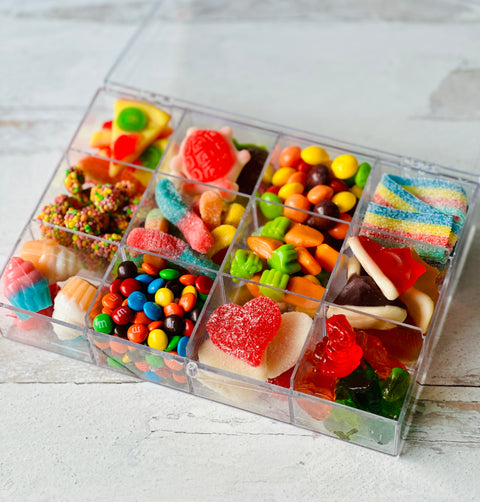 a plastic container filled with lots of candy