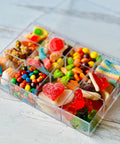 a plastic container filled with lots of candy