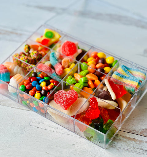 a plastic container filled with lots of candy