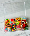 a plastic container filled with lots of candy