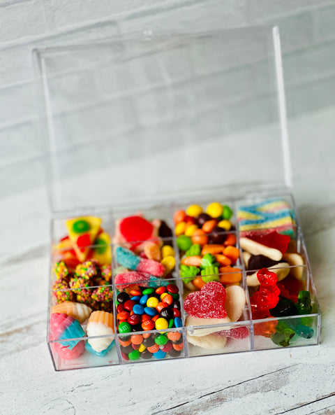 a plastic container filled with lots of candy