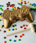 a video game controller next to some candy