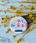 a button with the words happy birthday on it