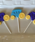 three lollipops with yellow and blue candies on them