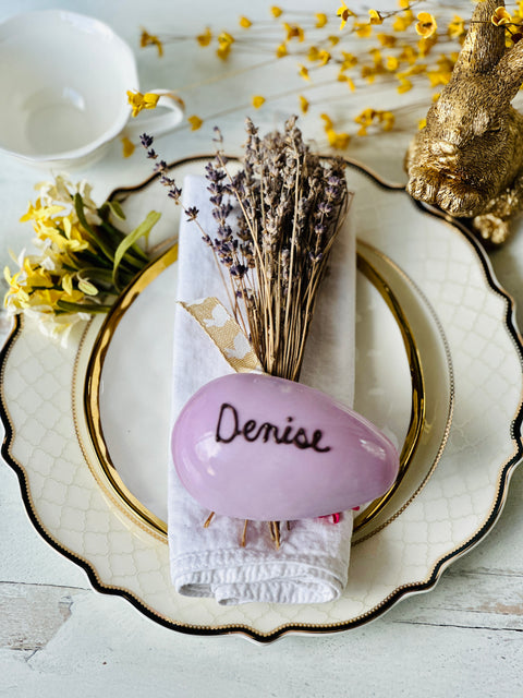 a place setting with flowers and a napkin