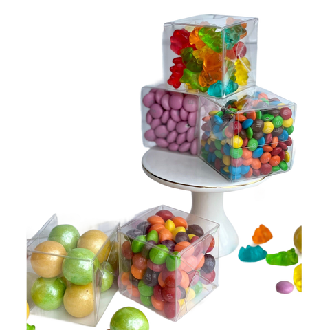 three plastic containers filled with candy and candies