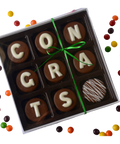 a box of chocolates with the word congratulations written on them