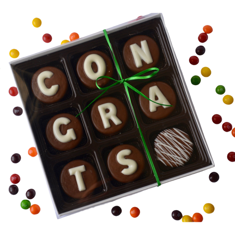 a box of chocolates with the word congratulations written on them