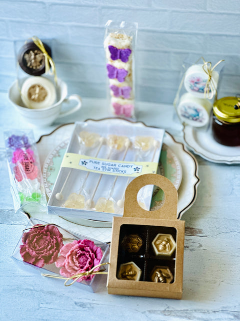 a box of chocolates sitting on top of a plate