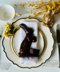 a plate with a chocolate bunny on it