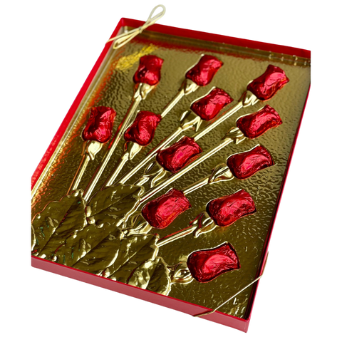 a close up of a box of red roses