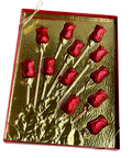 a close up of a metal object with red flowers on it